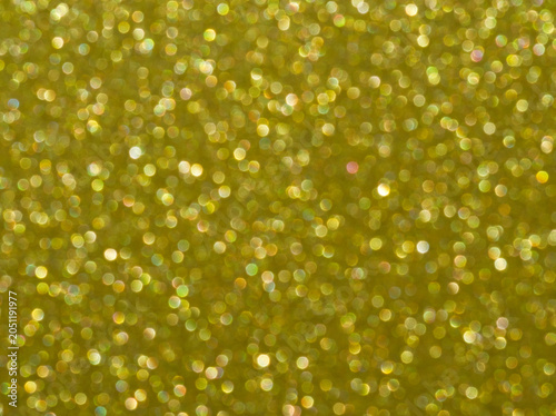 Gold. Golden sparkle background. Golden glitter background. Gold glimmer. Abstract twinkle texture. Glitter surface. Glimmer layout. Holiday layout. Golden luxury surface. Celebration background.
