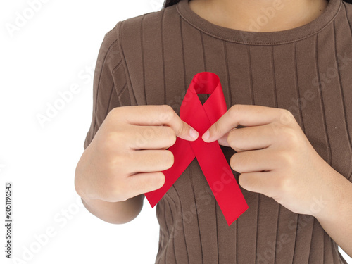 Woman holding red ribbon sign cancer.