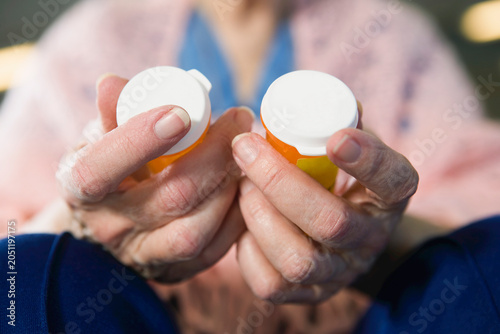 View of a senior woman holding medicines
