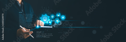 Businessman using AI automation and data analytics on a digital tablet to optimize business process, target marketing goals, global network connection, and machine learning technology