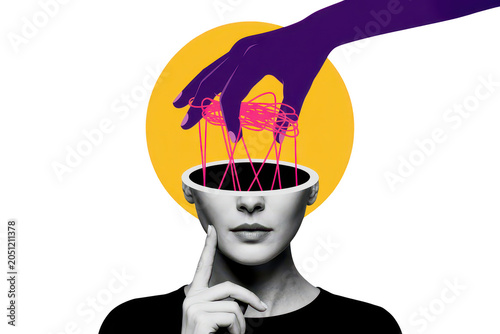 Conceptual of a human head being manipulated by a large purple hand pulling pink strings against a yellow circle