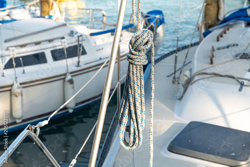 Photos Horizontal nautical scene in a marina with several sailboats docked, focusing on