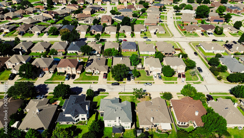 Extended residential gridline stretches across South Arlington near Mansfield Webb Rd with rows of homes arranged along intersecting streets bordered by clipped lawns, scattered trees, parked, TX