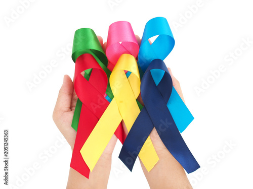 World cancer day, February 4. Woman holding blue, red, green, pink and yellow ribbons. Healthcare awareness day concept.