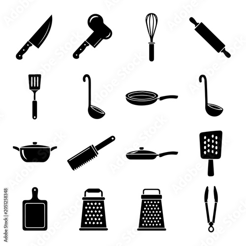 A collection of kitchen utensils and tools arranged on a clean surface.