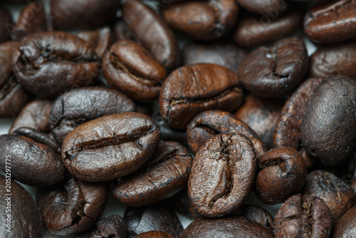 Dark roasted coffee beans  ,close up used  background