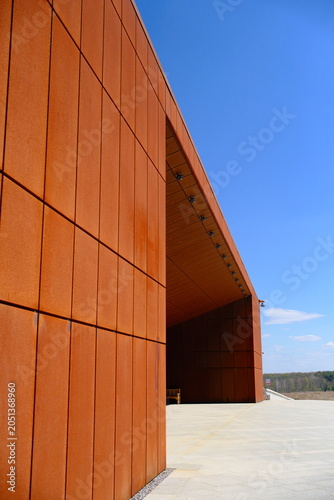 Modern architecture design building with weathering steel corten wall against blue sky