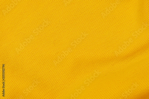 Konstfotografi Bright yellow fabric texture shown in close up, revealing woven patterns and smo