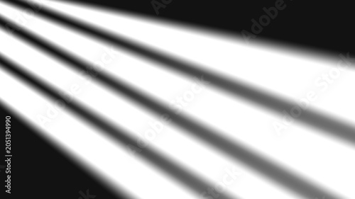 Fotografia diagonal light beams illuminating a dark space.