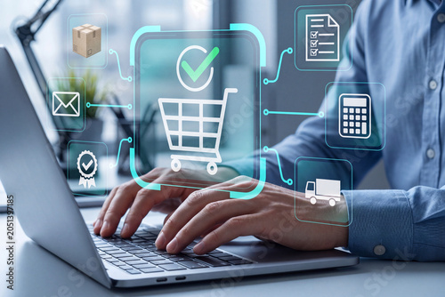 E-commerce order management platform displaying order processing, fulfillment workflows, inventory control, and online retail operations on a laptop interface.