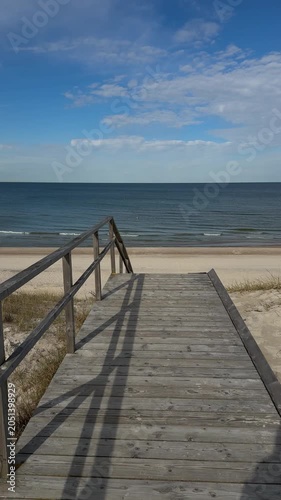 Wooden boardwalk leading to Baltic Sea beach