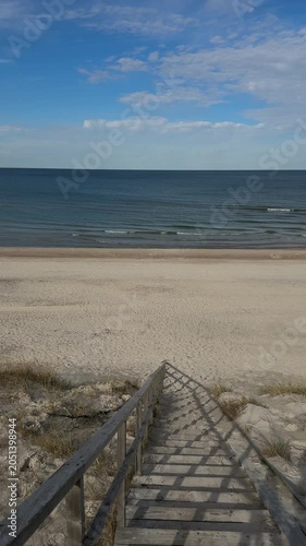 Wooden stairs over dunes to Baltic Sea beach