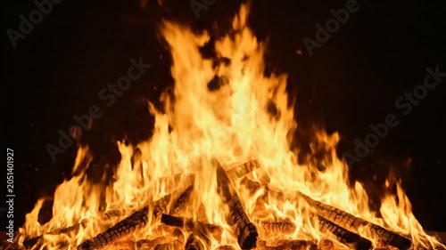 Blazing fire, burning flames, wooden logs, warm lighting, cozy ambiance