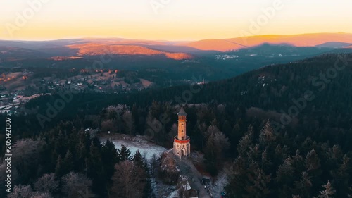 Explore Stepanka Lookout Tower in the Jizera Mountains during sunset. See how the light changes the landscape as winter and autumn blend together in Koronov.
