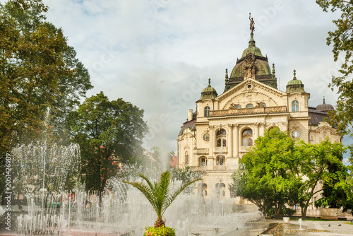 Kosice National Theater in baroque style with Singing Fountain on foreground, Main street, Kosice Old Town, Slovakia 