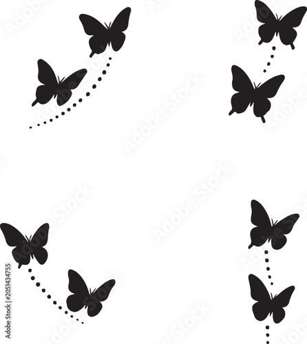 Black butterfly silhouettes with dotted flight trails isolated on a white background