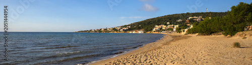 Karfas beach panoramic view with golden sand and calm blue sea in Chios island, Greece