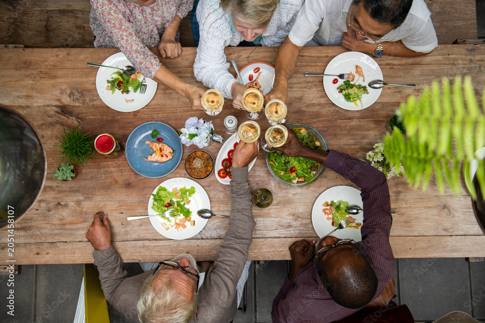 Fototapeta premium Celebratory meal with diverse friends