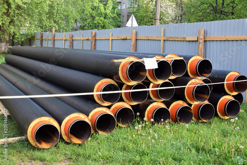 Replacing a section of heating main. Storing metal pipes with insulation.