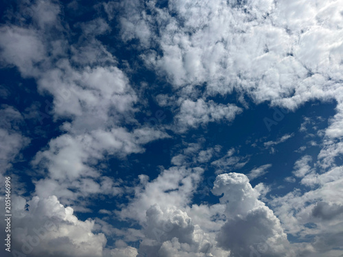 Schilderij op canvas Blue sky with cumulus and altocumulus clouds.