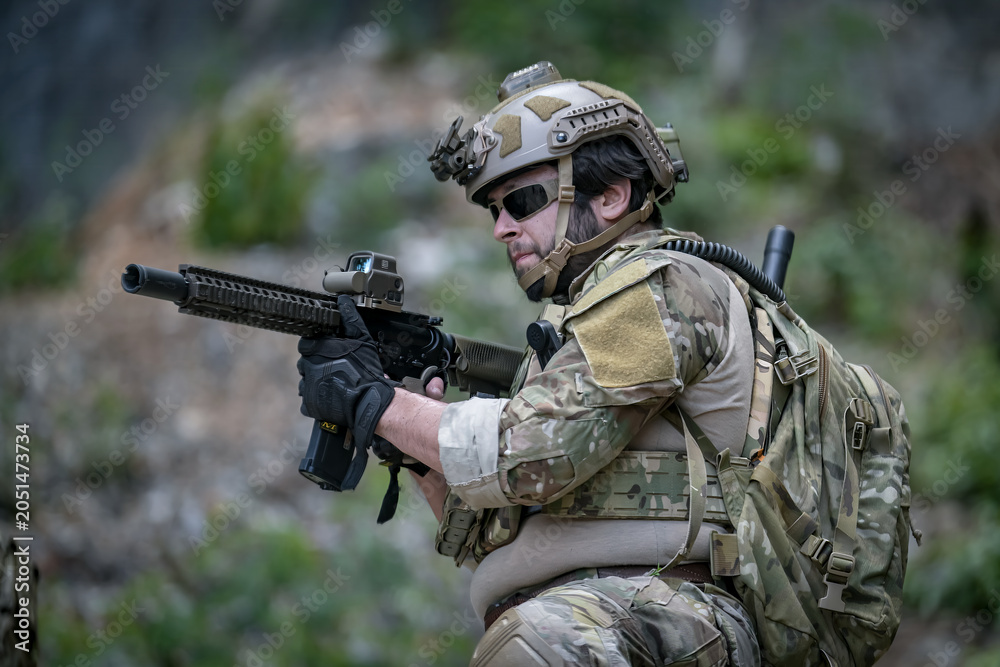 Fototapeta premium Tactical soldier in action with advanced weaponry and gear