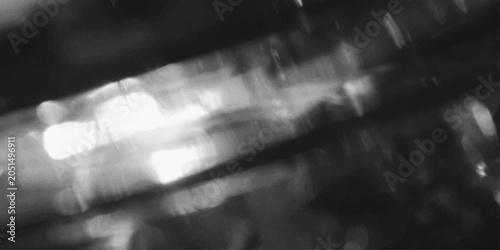 Obraz na plátne Abstract light streaks and bokeh effect in monochrome, creating a sense of movement and ethereal beauty