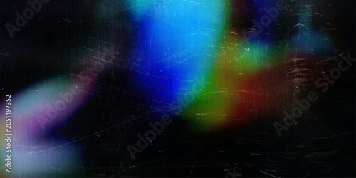Fotografie Abstract rainbow light leak effect with chromatic aberration and film grain overlay, creating a vintage and retro aesthetic on a dark background
