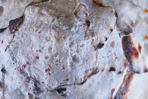 Фотография Close-up macro shot of the porous and calcareous texture of a snail shell