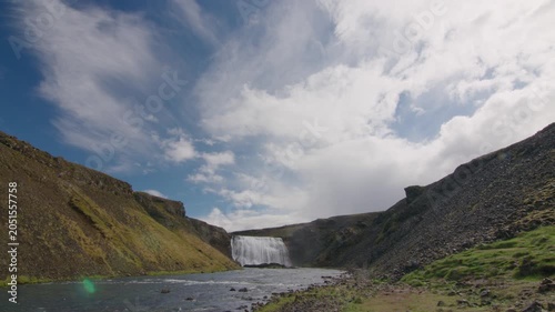 Scenic waterfall in summer Iceland sunny wide open sky