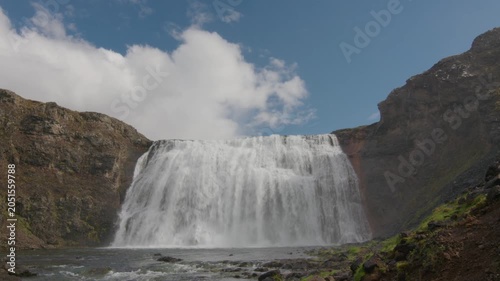 Scenic waterfall in summer Iceland sunny day