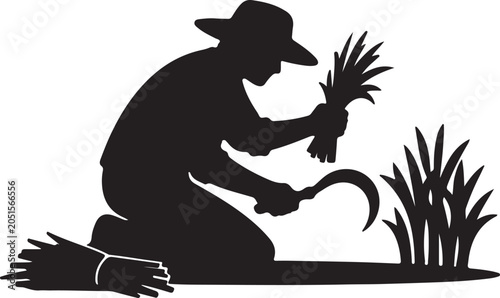 Farmer kneeling harvesting crop with sickle

