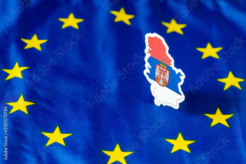 Schilderij op canvas Serbia flag cutout in the shape of country silhouette placed inside the star circle of the European Union flag