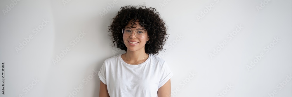 Obraz premium Curly Hair Woman Portrait Isolated On White Background With Friendly Smile