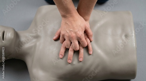 CPR Chest Compressions Training Mannequin Hands Interlaced Sternum Resuscitation