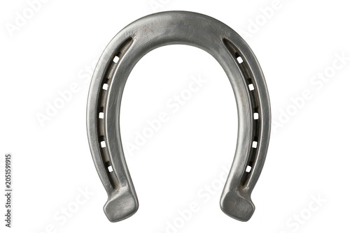 A shiny silver horseshoe, a symbol of luck and protection, isolated on a black background, metallic texture, equestrian hardware equipment