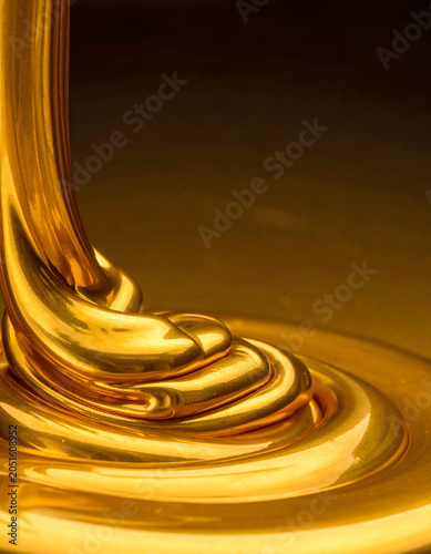 Molten gold swirls and flows creating fluid waves and rich, luxurious folds, evoking sense of wealth and elegance