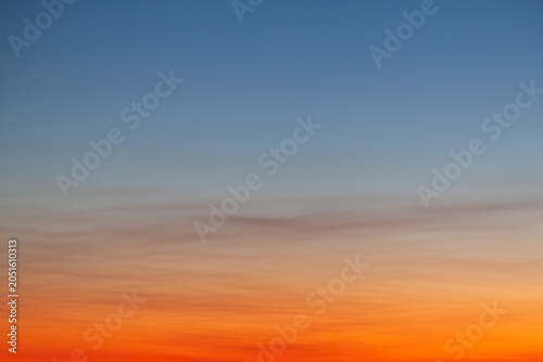 Clear and empty blue and orange gradient sky for background, horizontal image