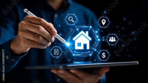 Man interacting with futuristic digital interface displaying real estate icons and network connections.