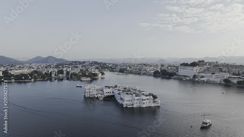 Drone View of Taj Lake Palace Udaipur on Lake Pichola Showing Luxury Floating Heritage Hotel, Royal Architecture, and Scenic Rajasthan Landscape
