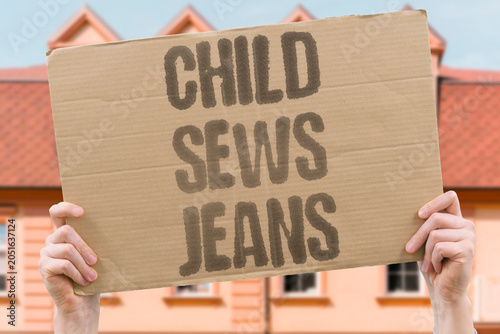 Konstfotografi "Child sews jeans" Young worker makes clothing