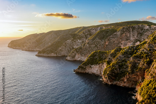 Steep coastal cliffs glowing at golden hour