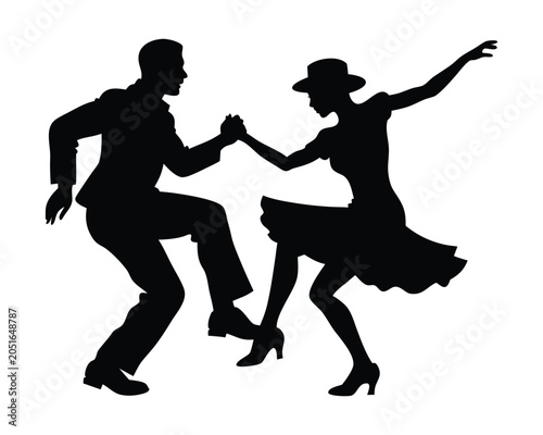 Silhouette of a couple dancing swing or rock and roll