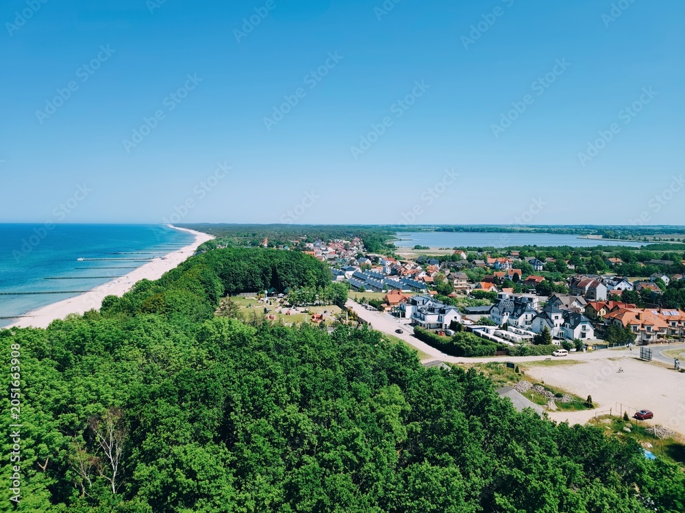Fototapeta premium Baltic Sea, Aerial coastal town with beach and forest