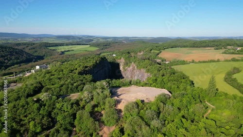 Experience the vastness of Velka Amerika, an abandoned limestone quarry near Prague. Surrounded by rich greenery, this location offers stunning views and a glimpse into nature's reclamation.