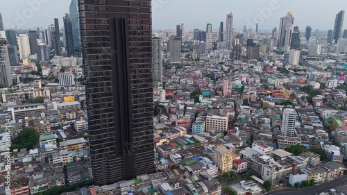 Aerial view of Bangkok skyline with modern skyscrapers and dense urban district