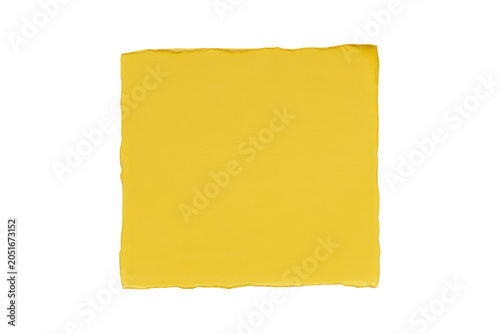 A single square piece of yellow paper with rough torn edges isolated on a black background, useful for notes, labels, or memo reminders