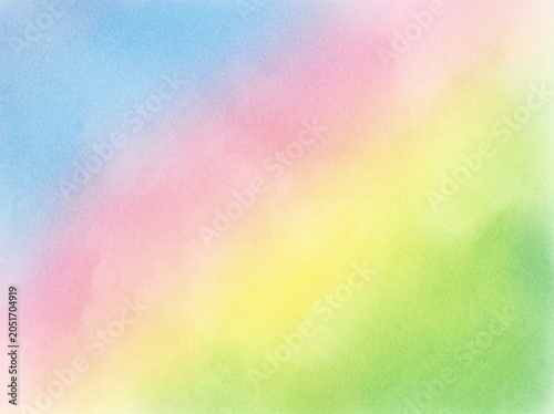 Soft pastel rainbow grainy gradient background featuring yellow green pink and blue hues for light ethereal design and cheerful springtime concepts.