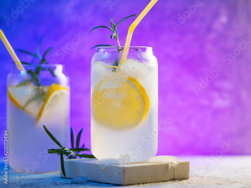 Two glasses of Summer refreshing citrus lemonade with rosemary