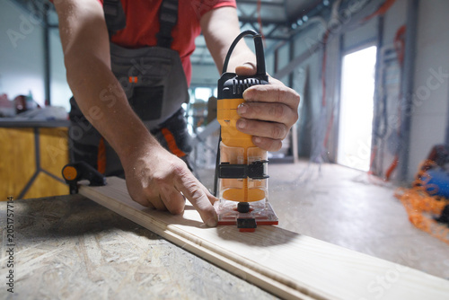Joiner chamfers a board 