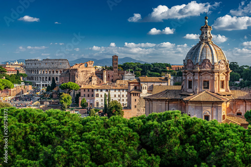 Rome skyline with the Colosseum and historic churches, Italy